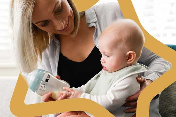 A mother and a baby with a Tommee Tippee feeding bottle.